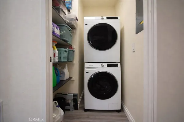 a view of a hallway with washer and dryer