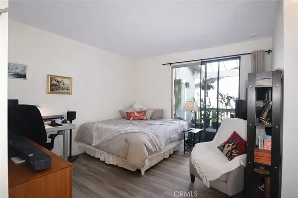 a bedroom with two beds and a large window