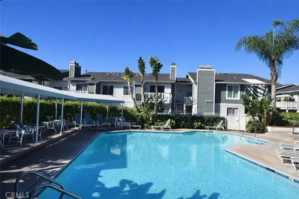 a front view of a house with swimming pool