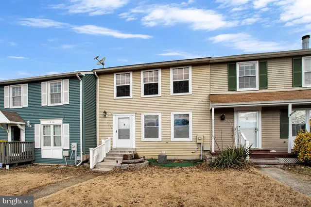 a front view of a house with yard