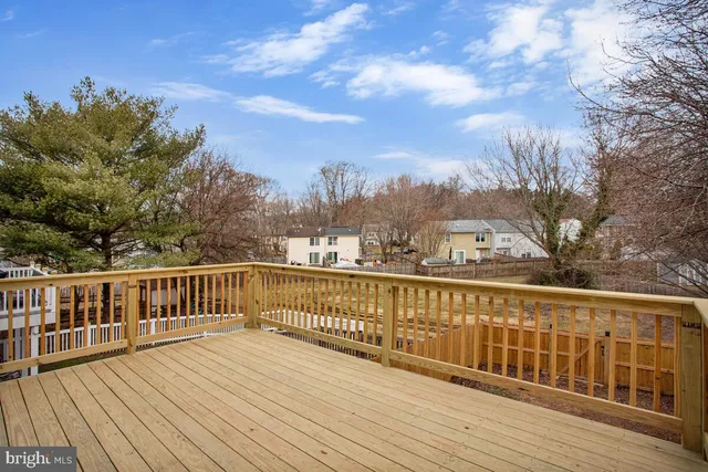 a view of a balcony with wooden floor