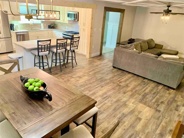 a living room with furniture and a table