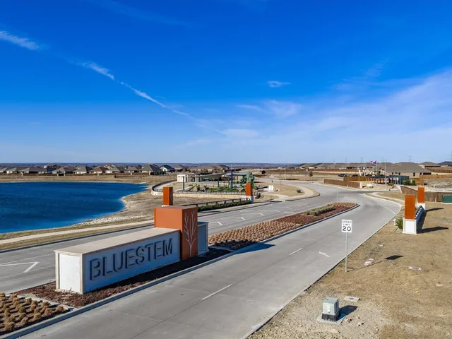 a view of a swimming pool and an outdoor seating