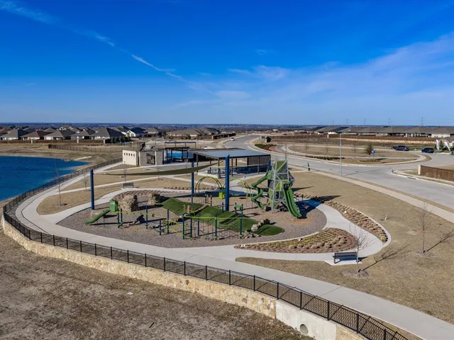 a view of a swimming pool with a table and chairs