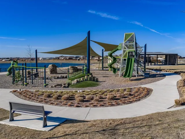 a view of a swimming pool with outdoor seating