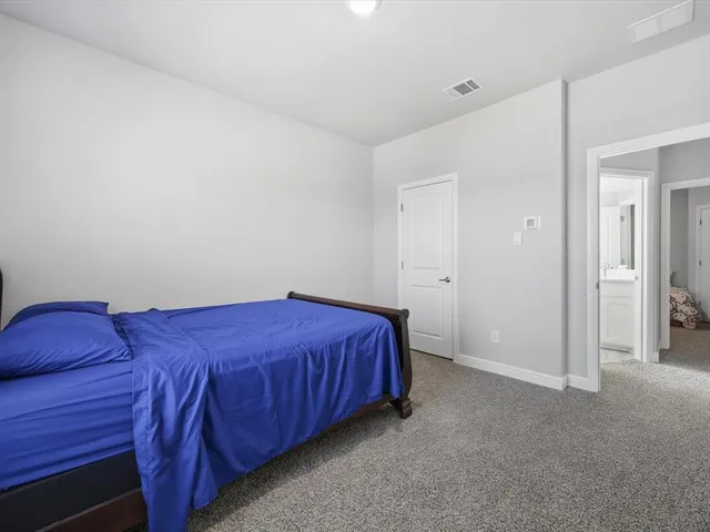 a bed room with a bed and a couch