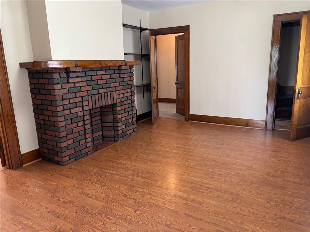 264 Hopwood Fairchance Road Uniontown, PA 15401 - Photo 6 of 19 a view of an empty room with wooden floor