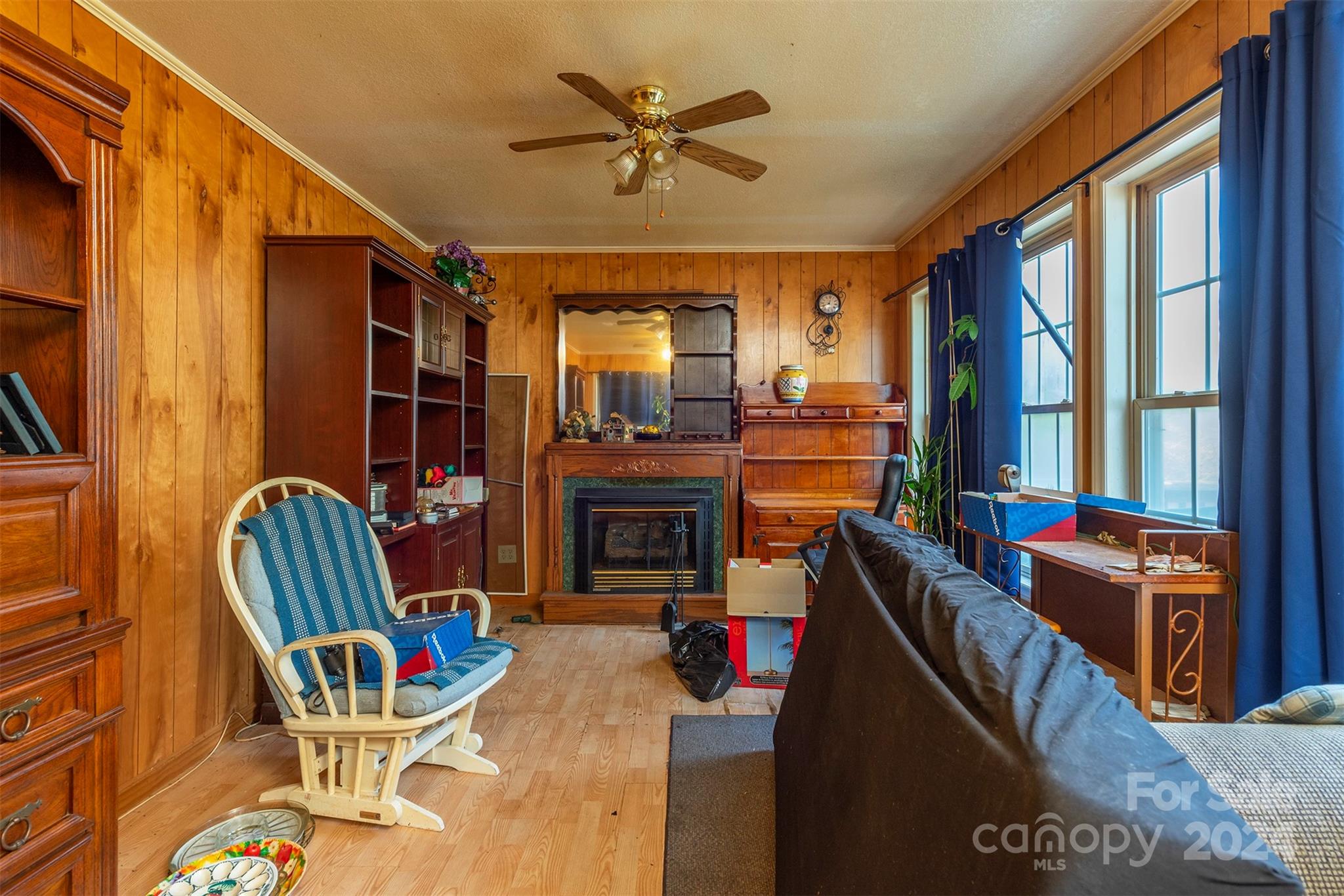 139 Hickory Street Rutherfordton, NC 28139 - Photo 6 of 19 a living room with furniture a fireplace and a large window