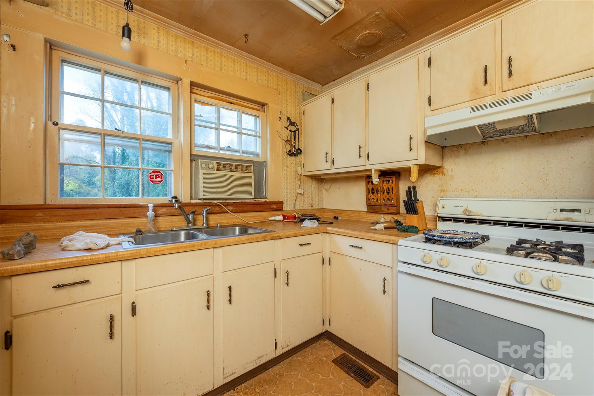 139 Hickory Street Rutherfordton, NC 28139 - Photo 9 of 19 a kitchen with a sink stove and cabinets