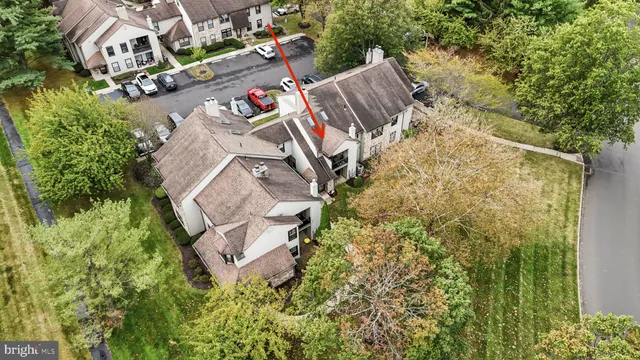 an aerial view of residential house with outdoor space and trees