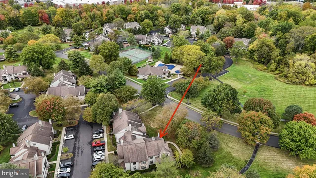 an aerial view of a house with yard swimming pool and outdoor seating