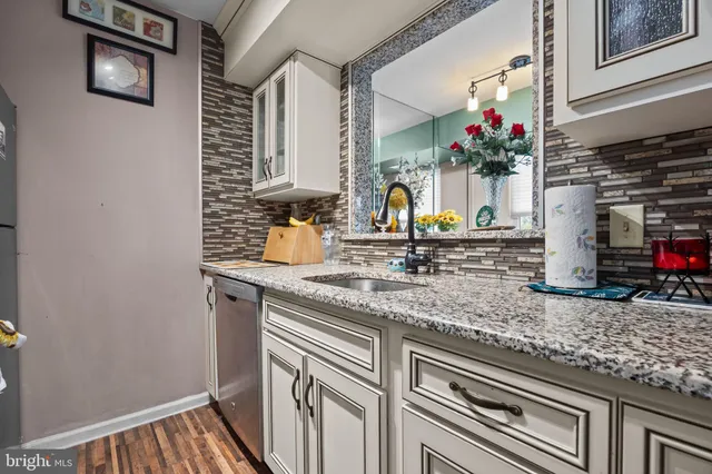 a bathroom with sink and mirror