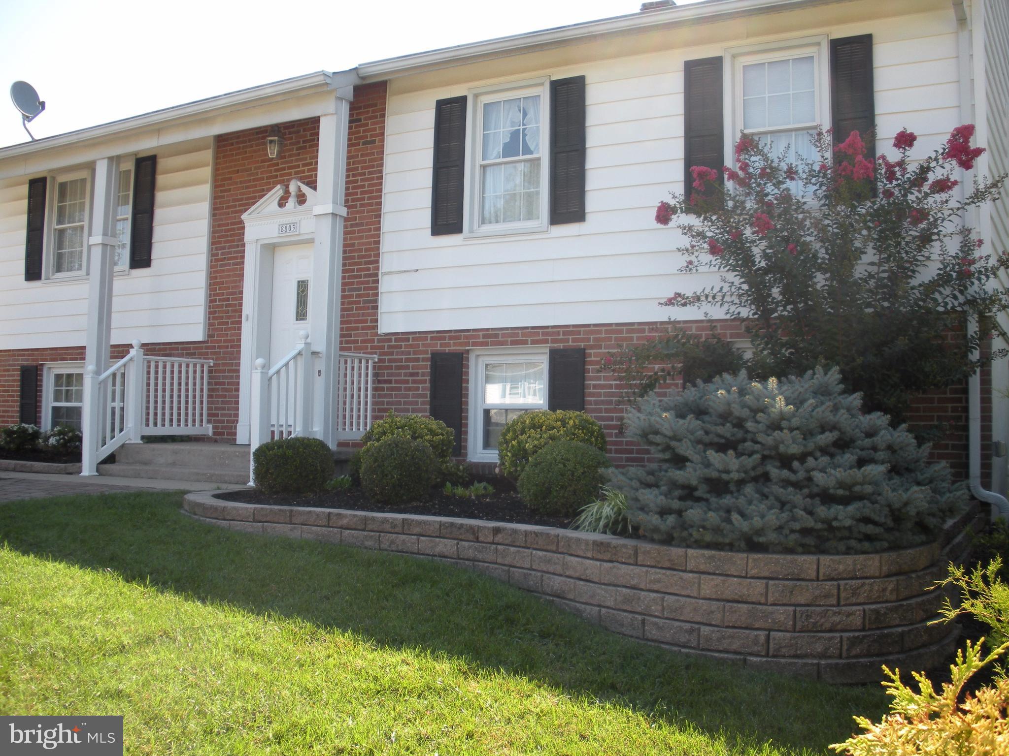 8803 Parlo Road Baltimore, MD 21236 - Photo 2 of 29 a front view of a house with garden