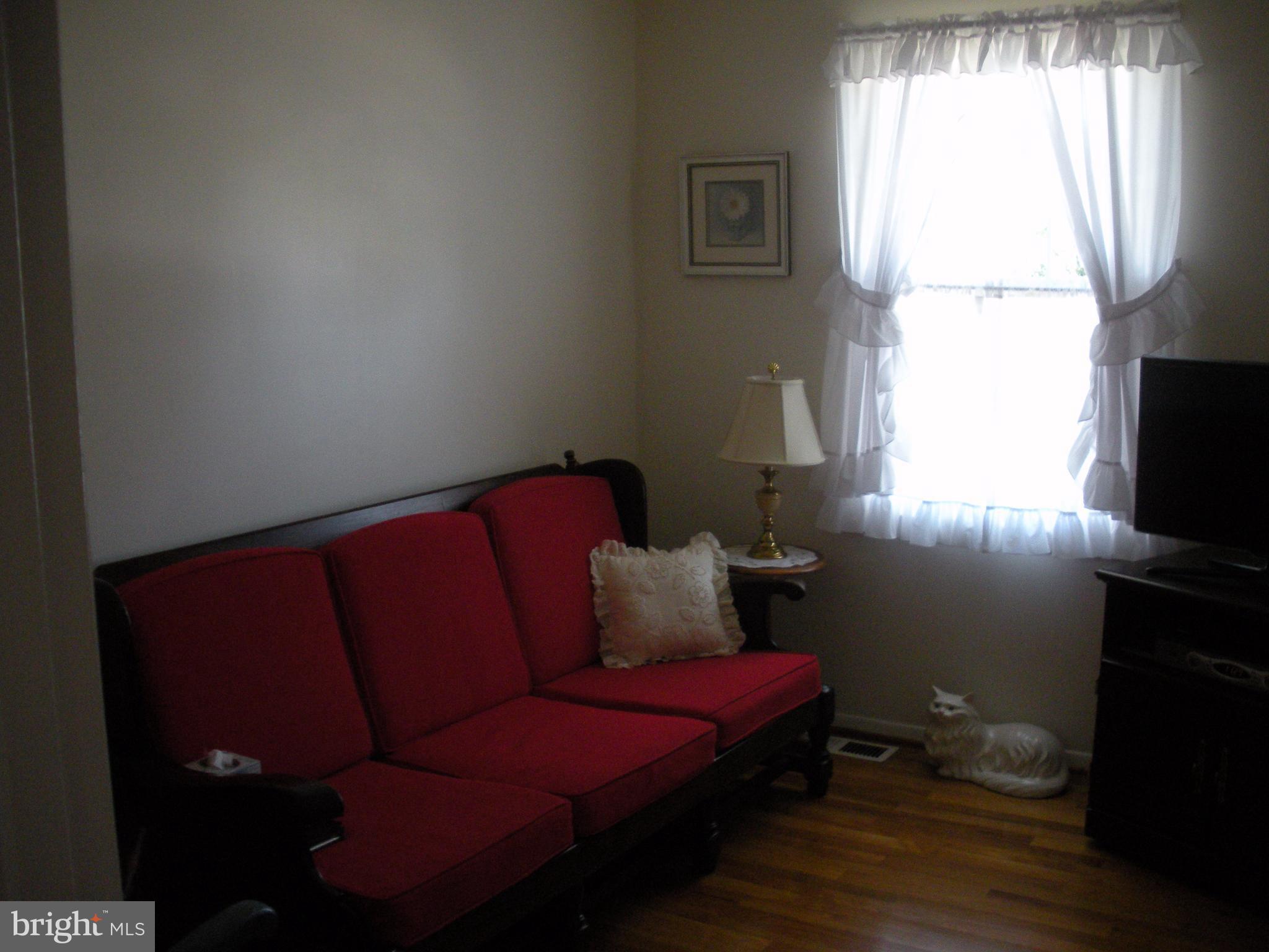 8803 Parlo Road Baltimore, MD 21236 - Photo 11 of 29 a living room with furniture and a window