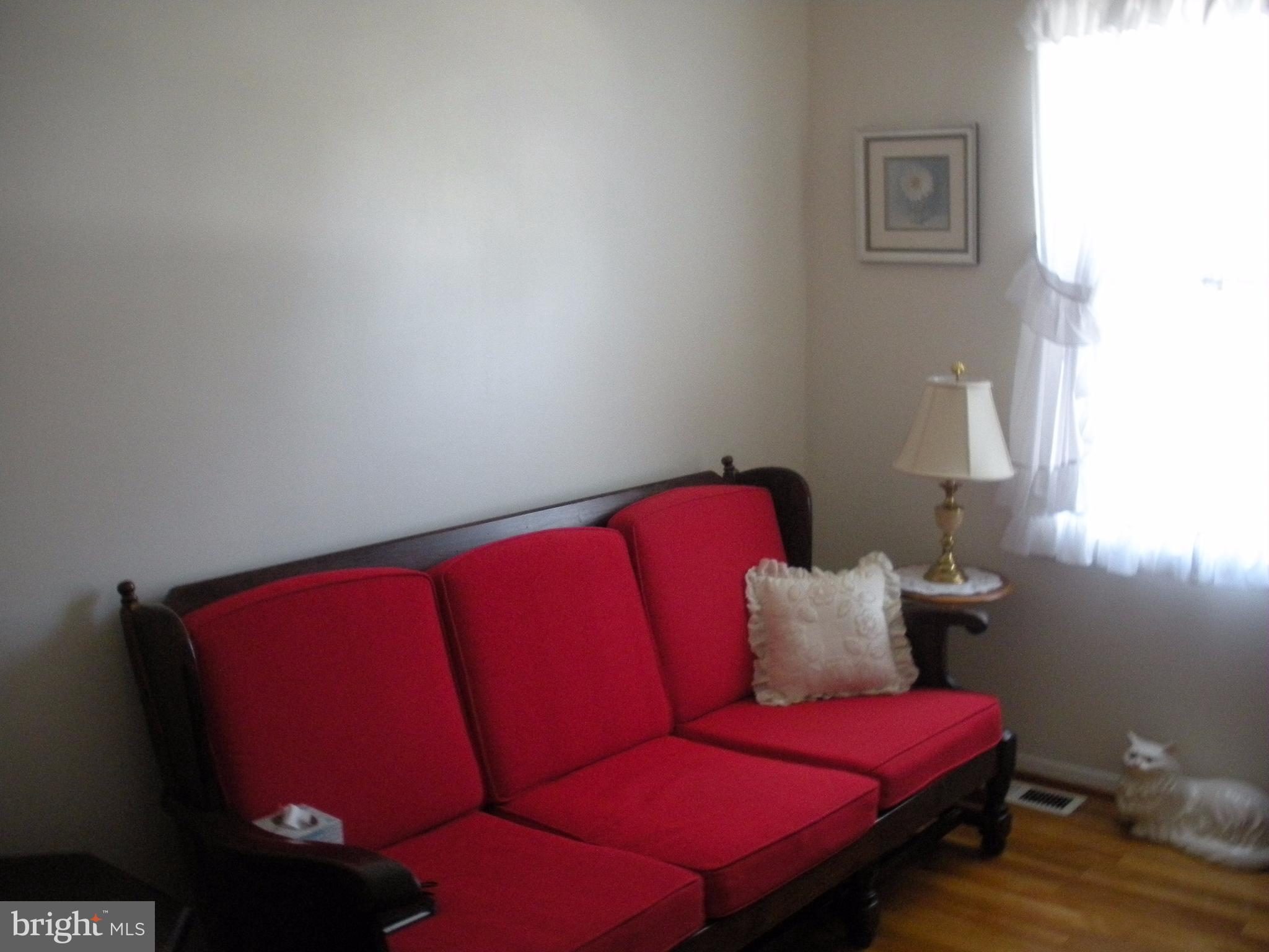 8803 Parlo Road Baltimore, MD 21236 - Photo 12 of 29 a living room with furniture and a lamp