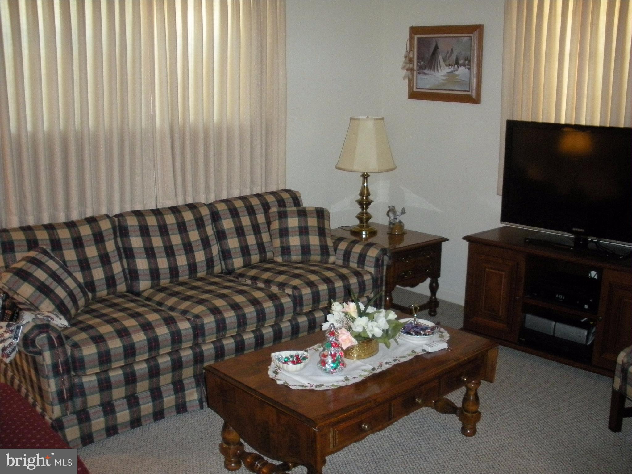 8803 Parlo Road Baltimore, MD 21236 - Photo 18 of 29 a living room with furniture and a flat screen tv