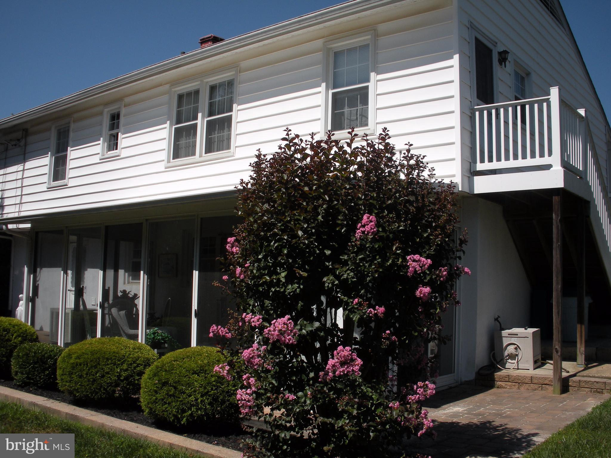 8803 Parlo Road Baltimore, MD 21236 - Photo 27 of 29 a view of a house that has a flower garden