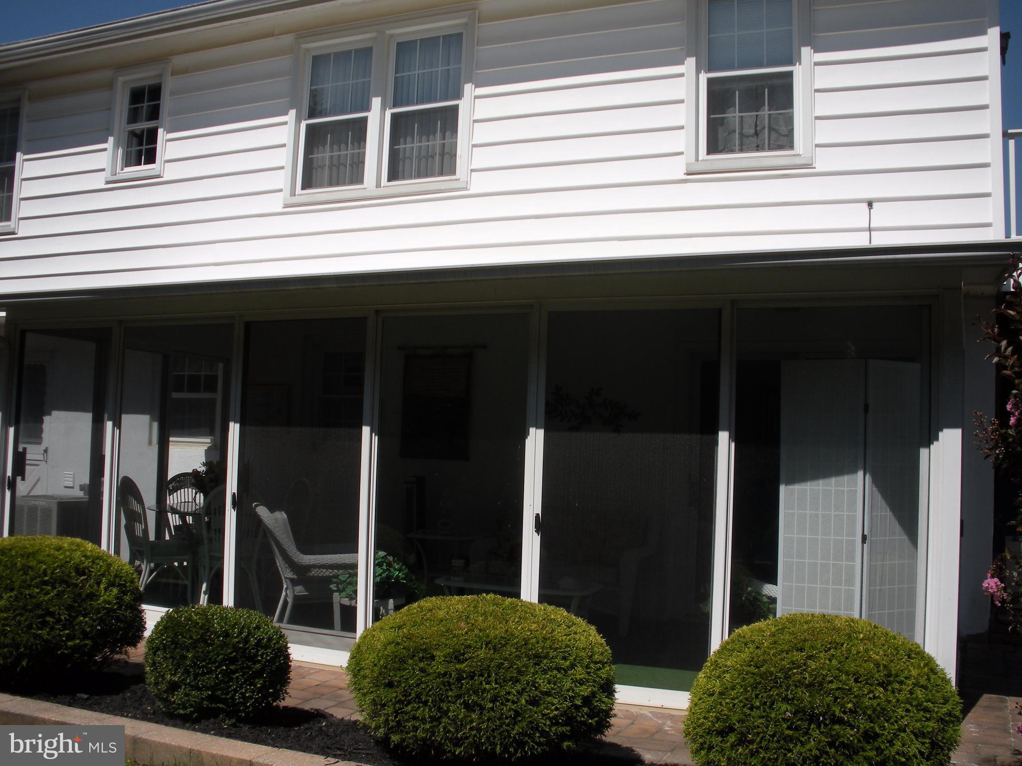 8803 Parlo Road Baltimore, MD 21236 - Photo 28 of 29 a backyard of a house with large windows