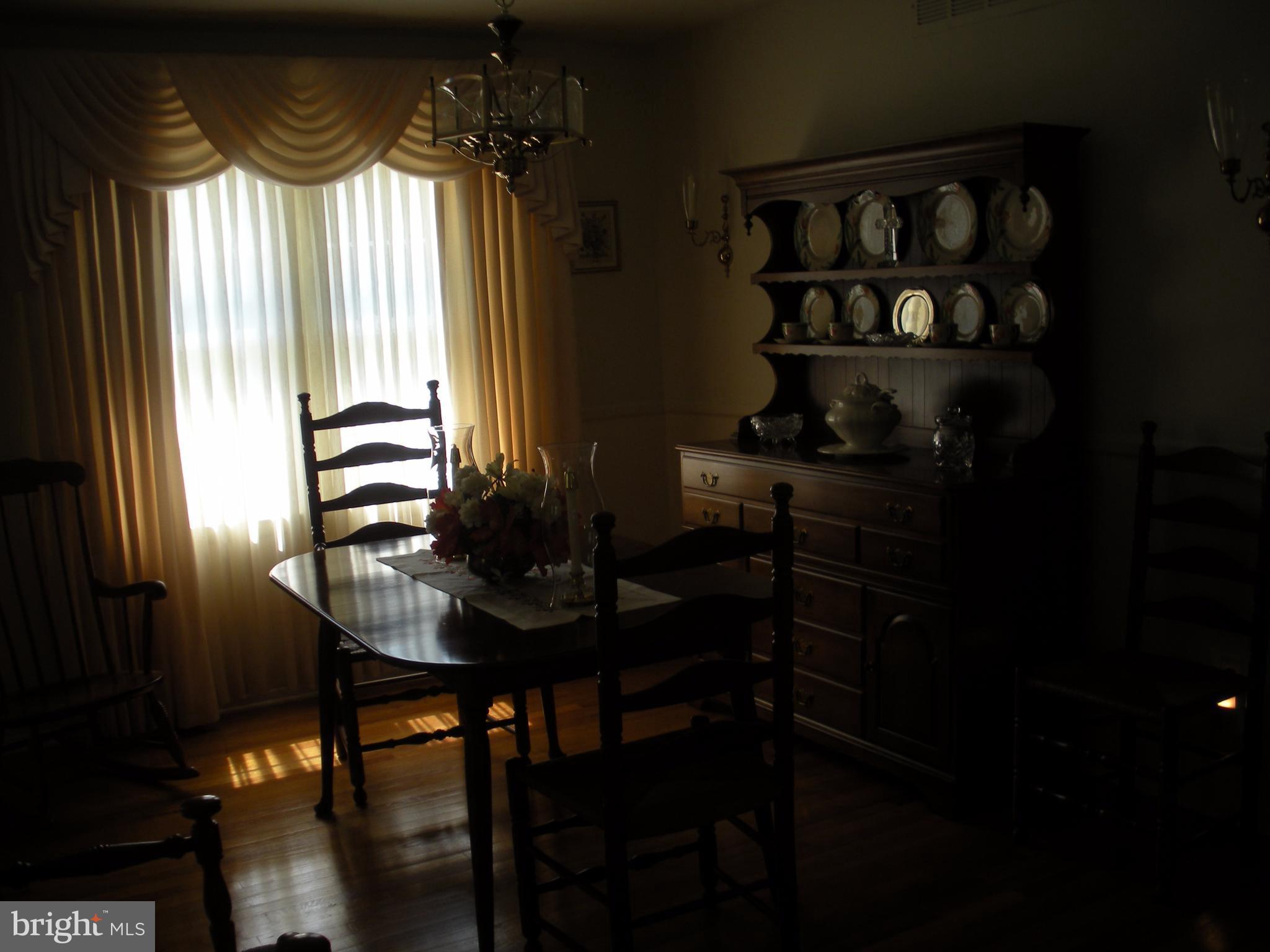 8803 Parlo Road Baltimore, MD 21236 - Photo 6 of 29 a dining room with furniture and window
