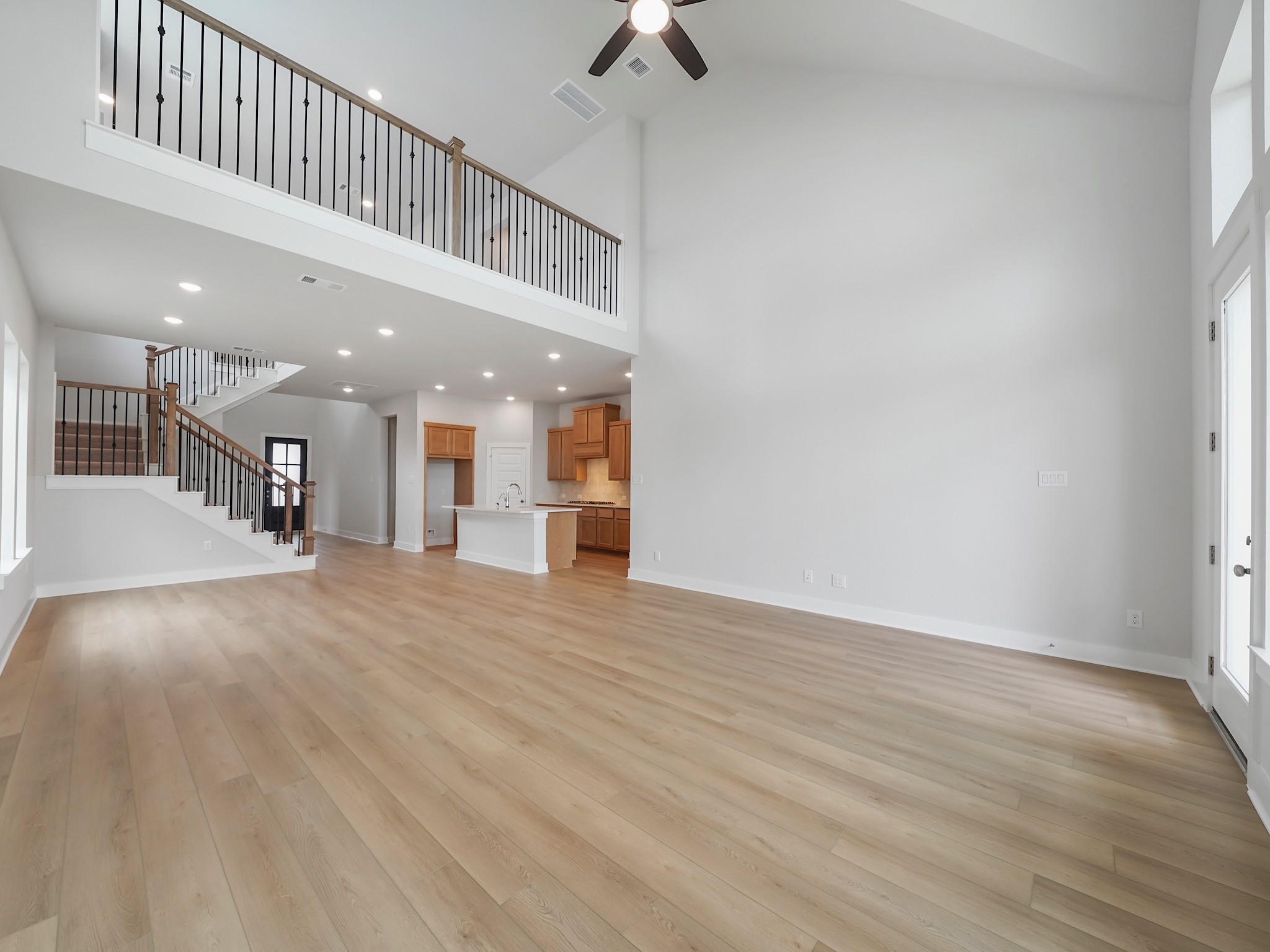 6010 Rolling Strm Court Fulshear, TX 77441 - Photo 7 of 23 Great room has ample space for your living room and dining area!