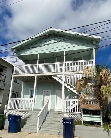 a view of a patio with a table and chairs