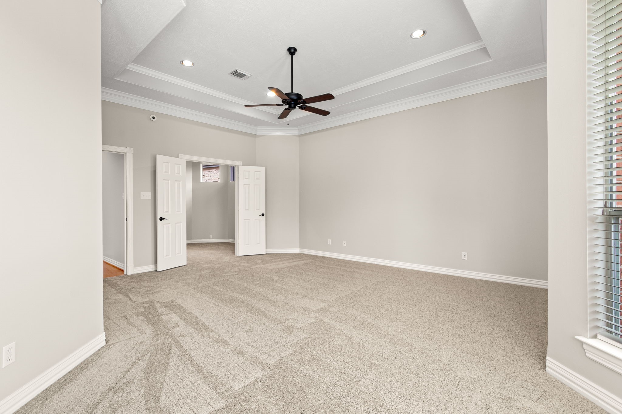 5803 Desert Oak Way Spring, TX 77379 - Photo 23 of 50 The tray ceiling and recessed lighting are amazing features.