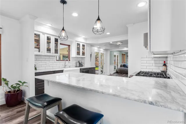 a large kitchen with granite countertop lots of counter top space