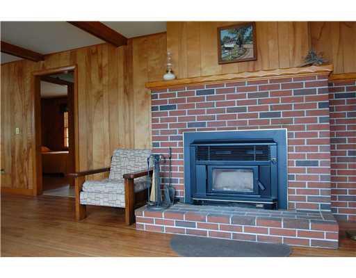 360 Heath Road Casco, ME 04015 - Photo 8 of 12 Living Room. Fireplace with wood insert