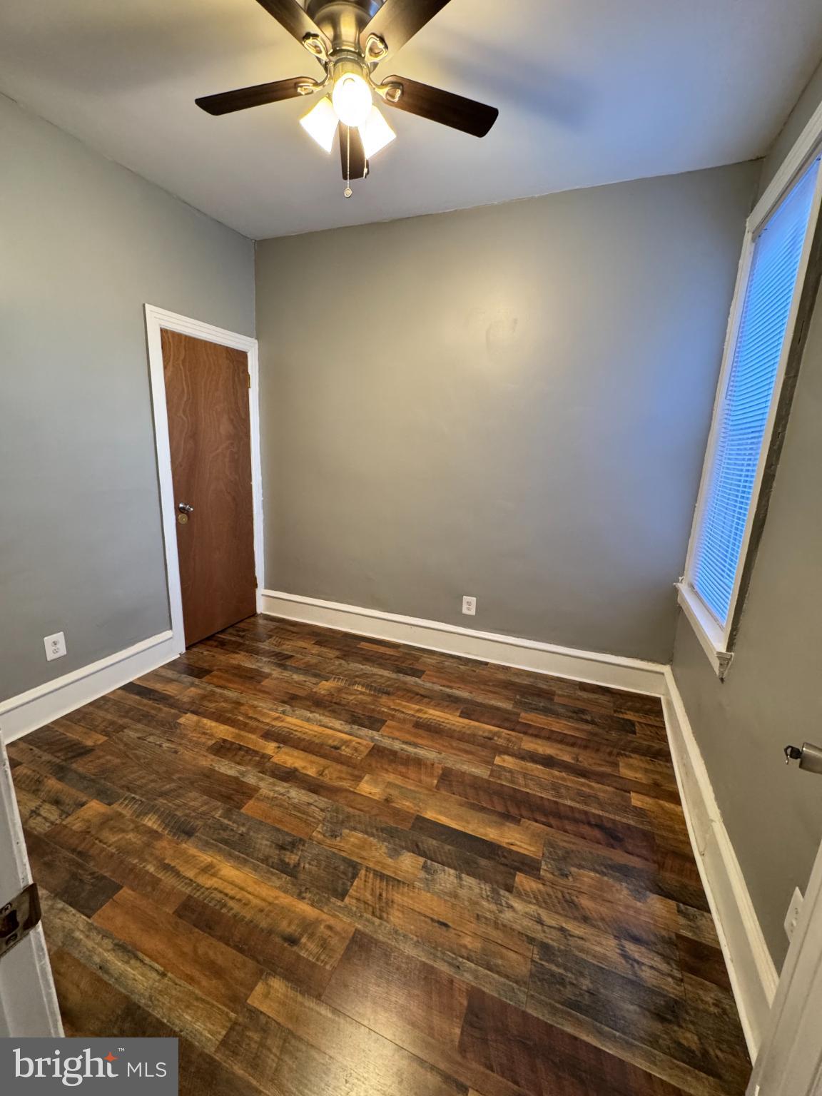 1908 West Somerset Street Philadelphia, PA 19132 - Photo 4 of 10 en empty room with wooden floor and fan