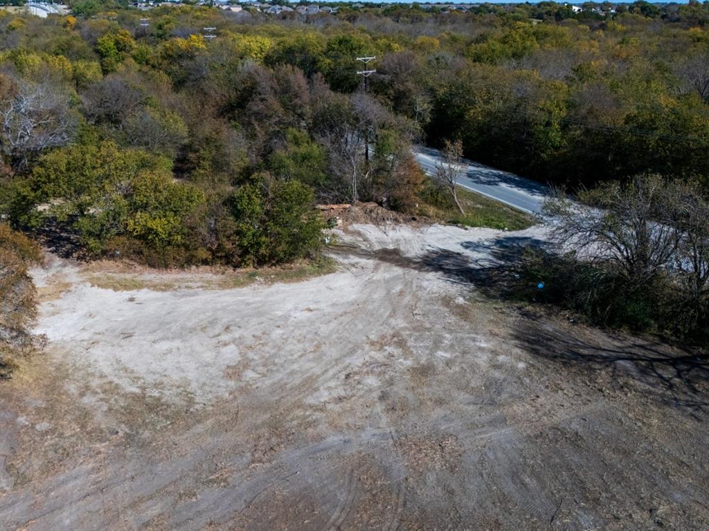 7909 Liberty Grove Road Rowlett, TX 75089 - Photo 11 of 20 a view of a dry yard with trees