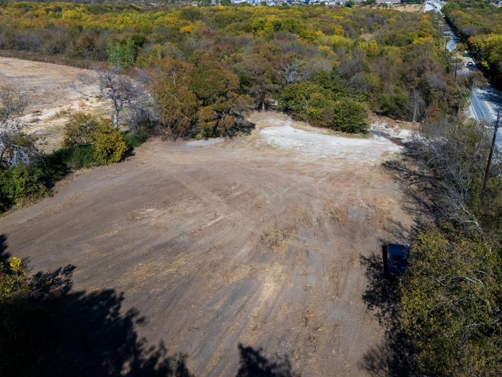 7909 Liberty Grove Road Rowlett, TX 75089 - Photo 12 of 20 a view of a dirt road with trees
