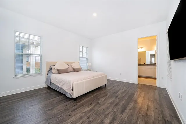 a room with a bed and a flat screen tv