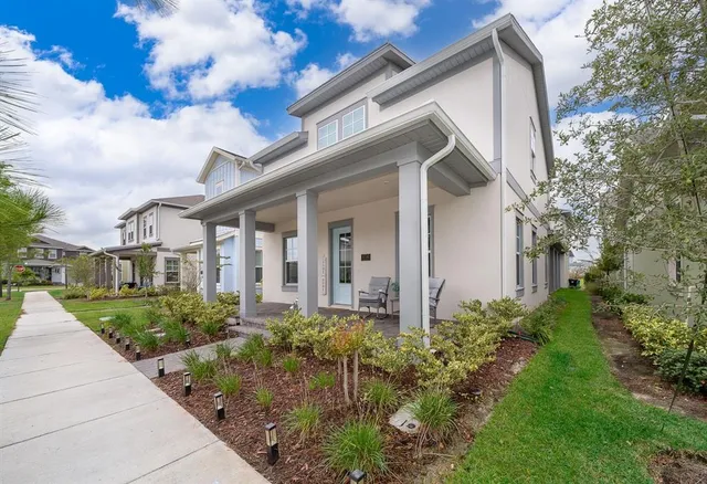 a front view of a house with garden