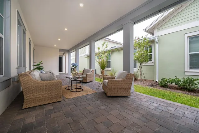 a living room with furniture and a garden
