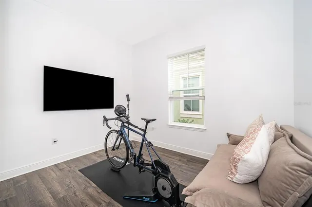 a view of a livingroom with furniture and a flat screen tv