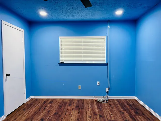 a white toilet sitting next to a bathroom sink and vanity
