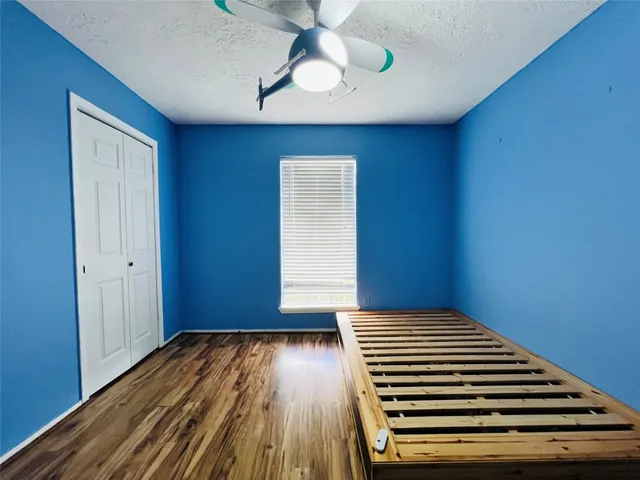 a view of room with stairs and wooden floor