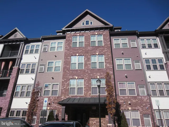 a front view of a building with a yard