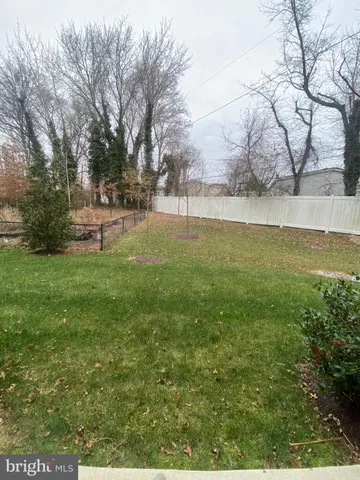 a view of a yard with an trees