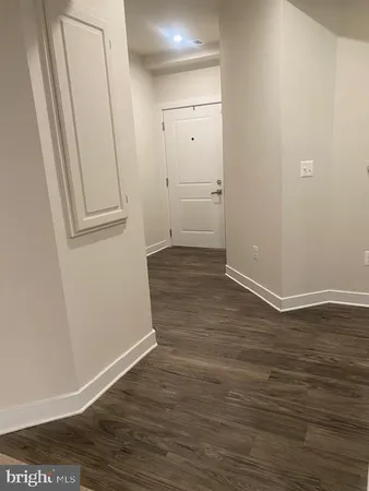 an empty room with wooden floor