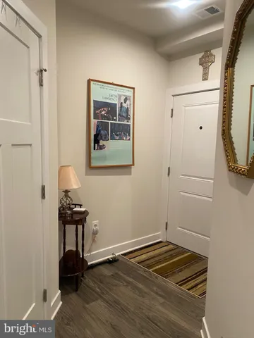 a room with wooden floor and a window