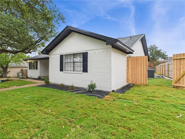 a backyard of a house with seating space
