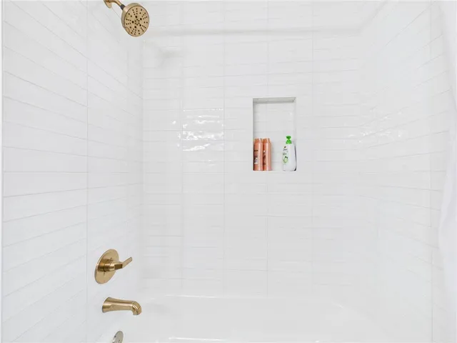 a bathroom with a toilet and a window