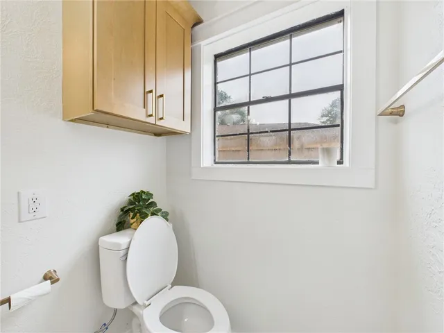a view of backyard with a garden and trees