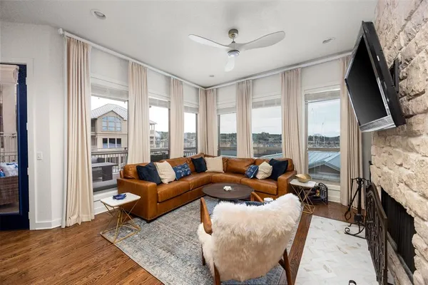 a living room with furniture fireplace and a flat screen tv