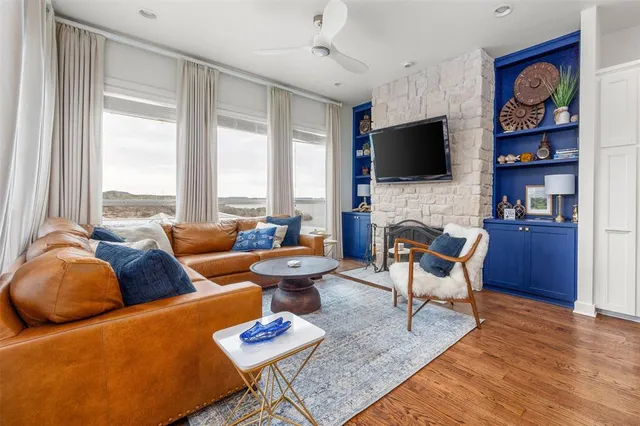 a living room with furniture fireplace and a flat screen tv
