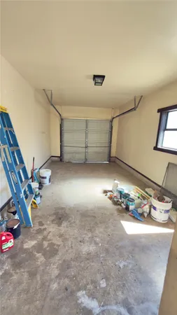 a view of a garage with rack and bicycle