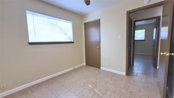 an empty room that has a window