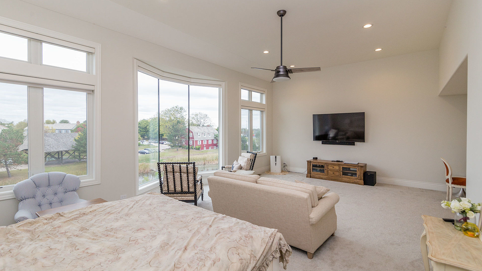 1412 Rue Paris Place Palatine, IL 60067 - Photo 11 of 20 a bedroom with a bed a large window and a flat screen tv