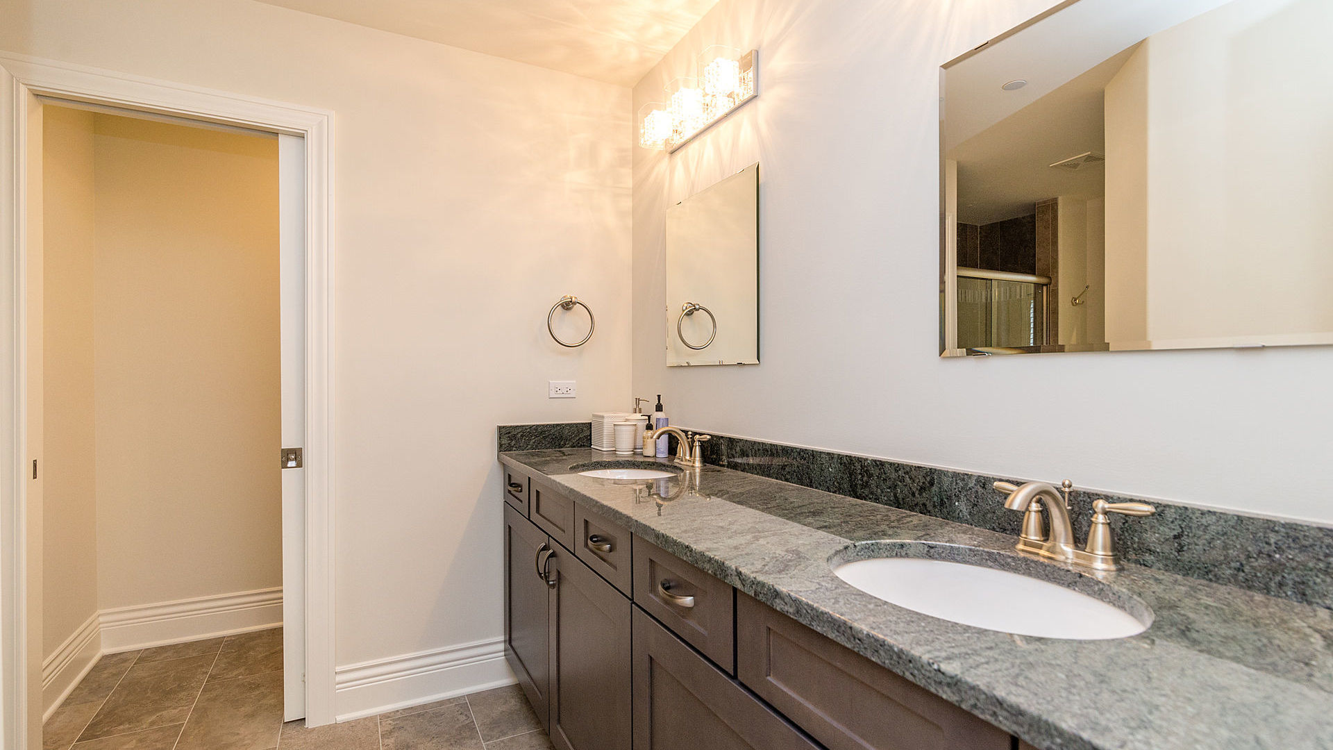 1412 Rue Paris Place Palatine, IL 60067 - Photo 13 of 20 a bathroom with a granite countertop sink and a mirror